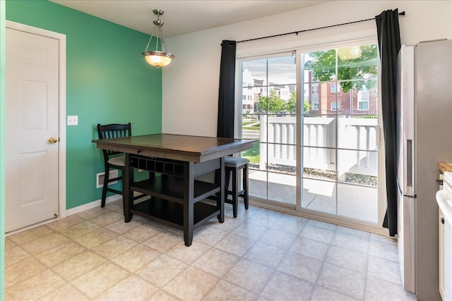 dining room featuring visible vents and baseboards