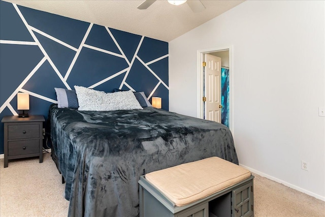 bedroom with light carpet, ceiling fan, baseboards, and vaulted ceiling