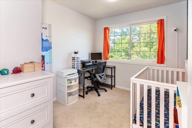 bedroom with light carpet and baseboards