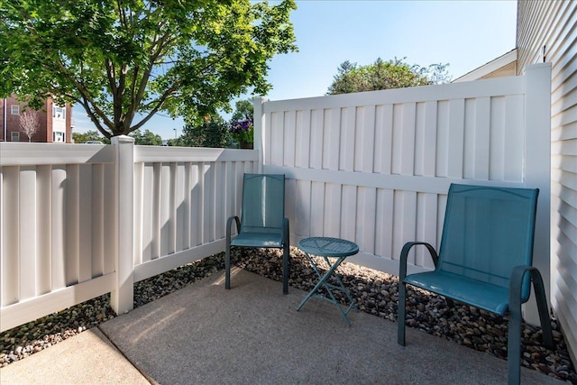 view of patio featuring fence