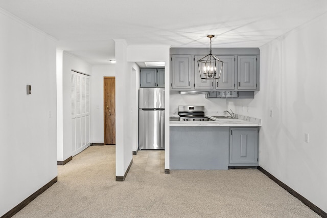 kitchen with stainless steel appliances, light carpet, gray cabinets, and light countertops