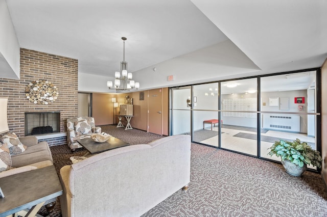 living room with floor to ceiling windows, a brick fireplace, carpet, and an inviting chandelier