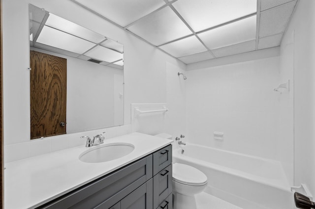 full bathroom featuring shower / bath combination, a paneled ceiling, toilet, and vanity