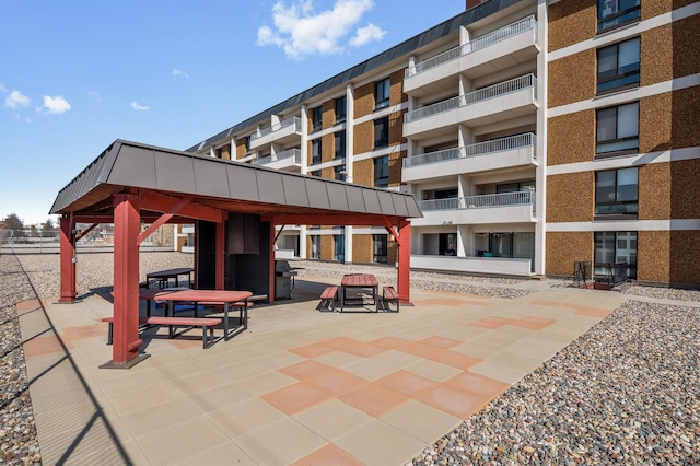 exterior space with a gazebo and grilling area