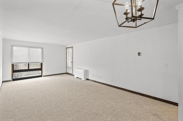 6400 York Ave S Unit 505, Edina, MN 55435 - carpeted spare room featuring ornamental molding, radiator, baseboards, and a chandelier