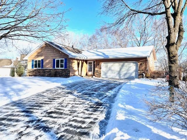 view of front of property with a garage and driveway