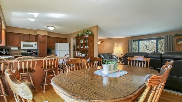 dining space with light wood-style floors