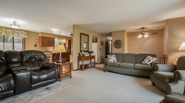 living room featuring ceiling fan and light carpet