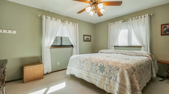 bedroom with baseboards, ceiling fan, and carpet flooring