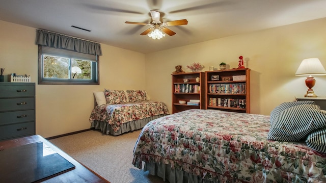 bedroom featuring visible vents, baseboards, carpet, and ceiling fan