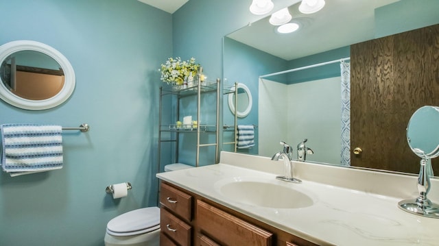 bathroom with vanity, toilet, and a shower with curtain