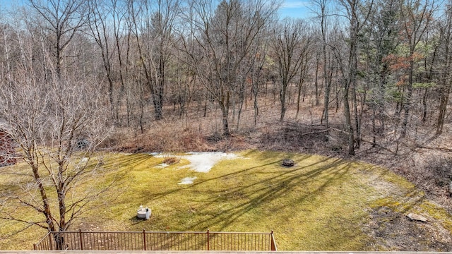 view of yard featuring a forest view