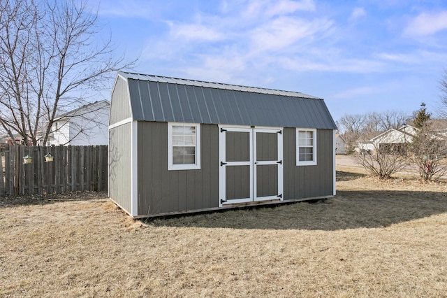 view of shed with fence