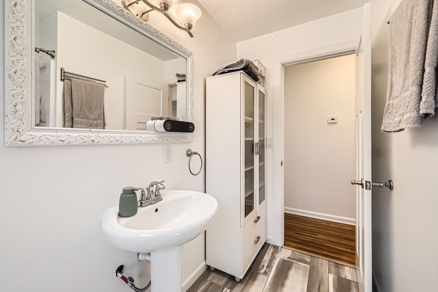 bathroom featuring wood finished floors