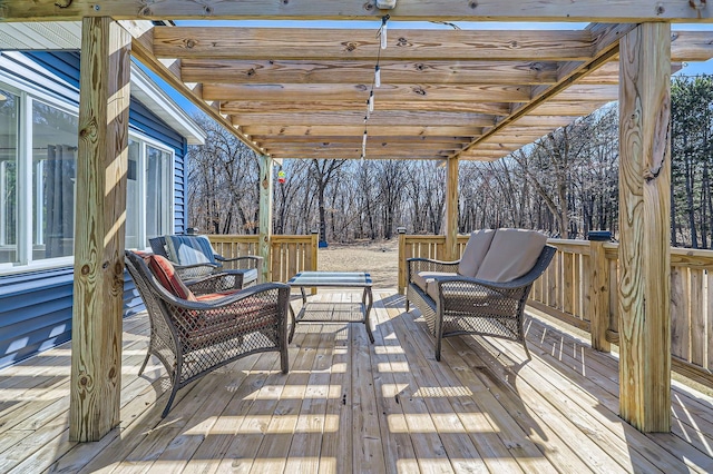 wooden terrace featuring a pergola and an outdoor living space
