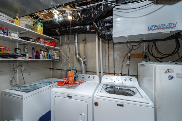 laundry area with independent washer and dryer and laundry area