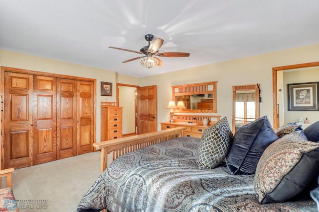 bedroom featuring a ceiling fan and carpet