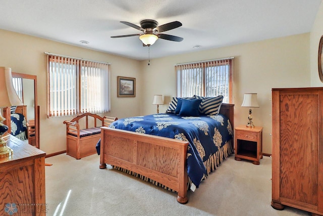 bedroom with baseboards, multiple windows, and carpet