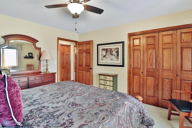 carpeted bedroom with a closet and ceiling fan