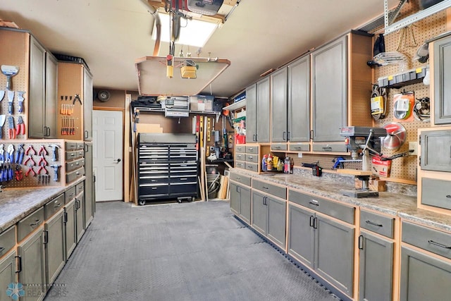 interior space featuring a workshop area and a garage door opener