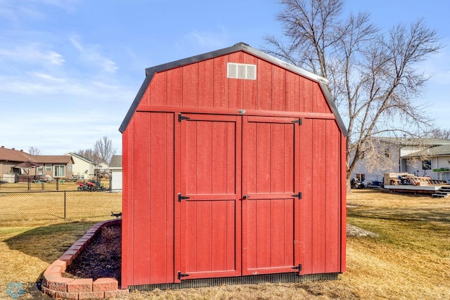 view of shed with fence