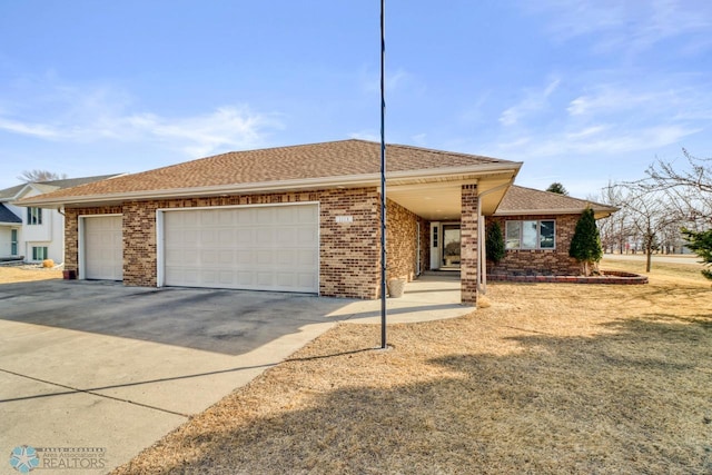 single story home featuring brick siding, an attached garage, concrete driveway, and a shingled roof