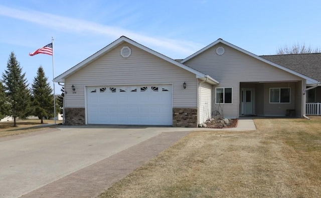 single story home with a garage and driveway