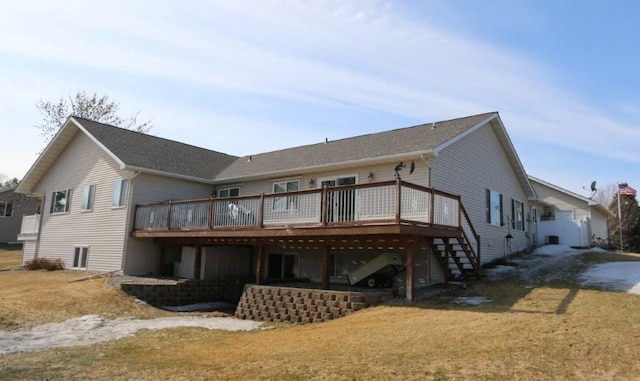 rear view of house featuring a deck and stairs