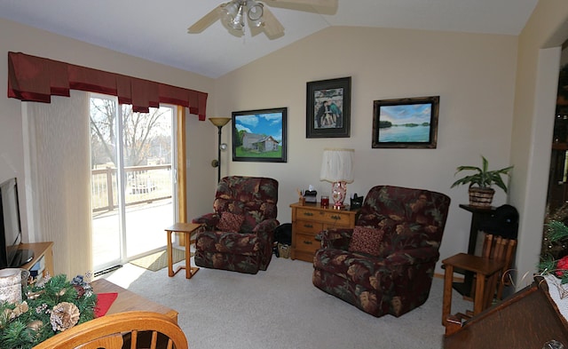 sitting room featuring carpet floors, a ceiling fan, and vaulted ceiling