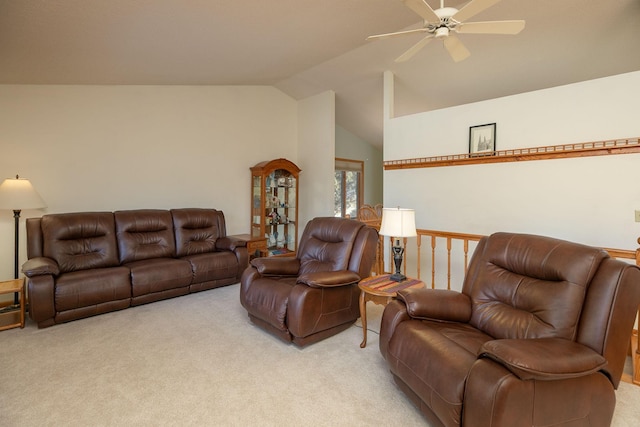 living room with light colored carpet, lofted ceiling, and a ceiling fan