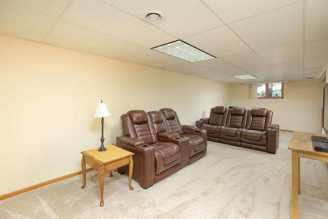 home theater with a paneled ceiling, baseboards, and carpet floors