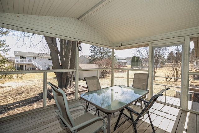 wooden deck with a storage shed, an outdoor structure, and outdoor dining area