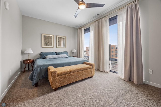 carpeted bedroom with access to exterior, visible vents, ceiling fan, and baseboards