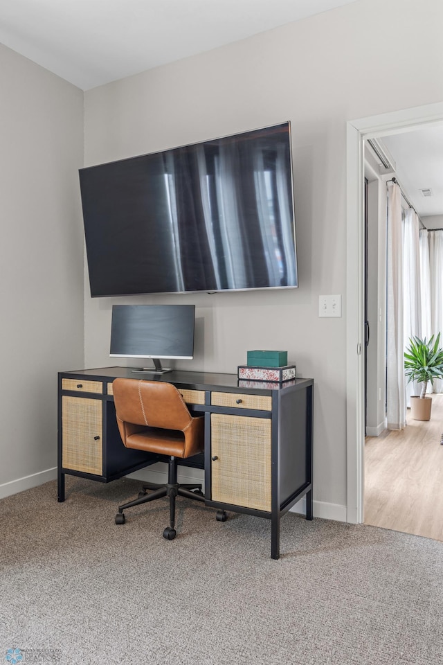 office space featuring carpet and baseboards