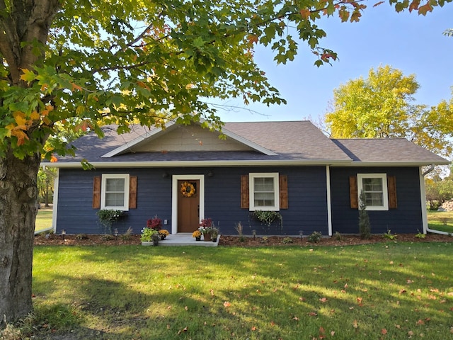 single story home featuring a front yard