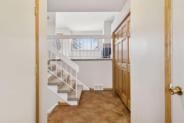 interior space with baseboards and visible vents