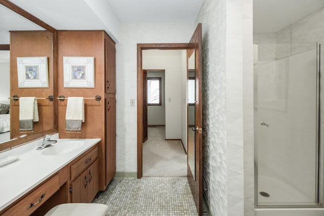 bathroom featuring vanity and a shower stall