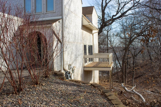 view of side of property with a balcony