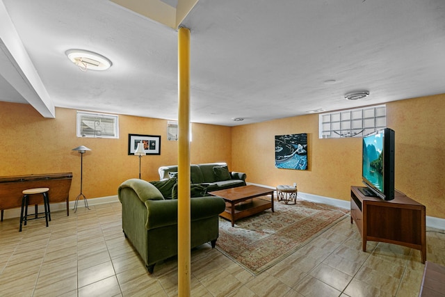 living room with tile patterned floors and baseboards