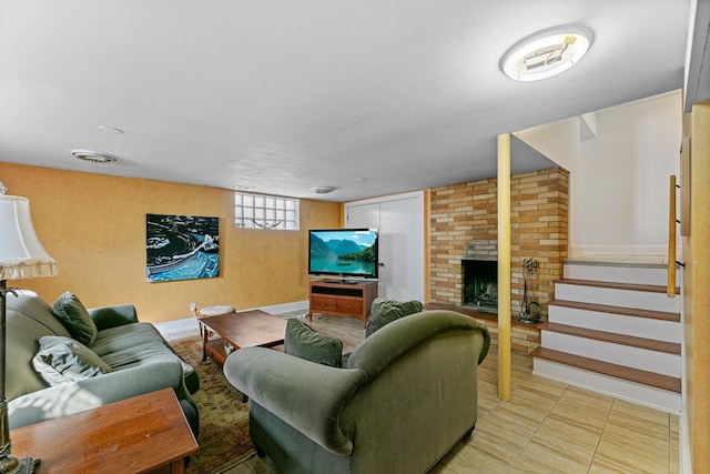 living area featuring stairs and a fireplace