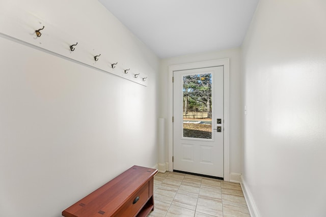 entryway featuring baseboards