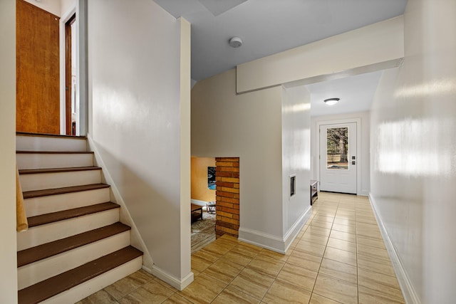 interior space with tile patterned floors and baseboards