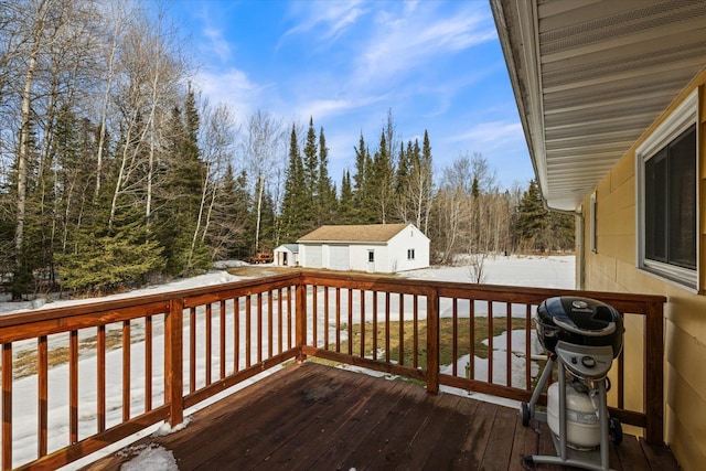 snow covered deck with grilling area