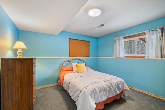 bedroom with visible vents, baseboards, and carpet