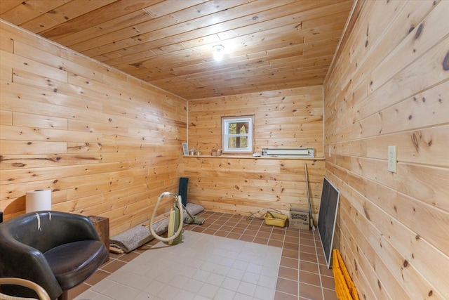 living area with tile patterned flooring, wooden walls, and wood ceiling