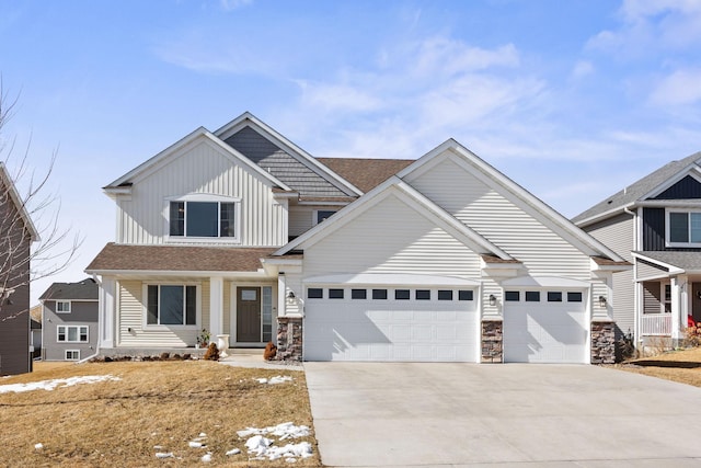 craftsman-style house with stone siding, roof with shingles, board and batten siding, concrete driveway, and an attached garage