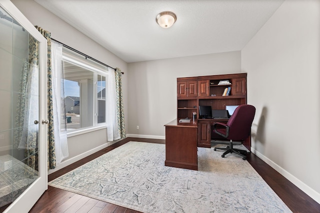 office space featuring dark wood finished floors and baseboards