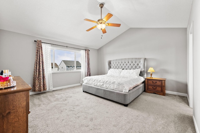 bedroom featuring baseboards, a ceiling fan, lofted ceiling, and carpet floors