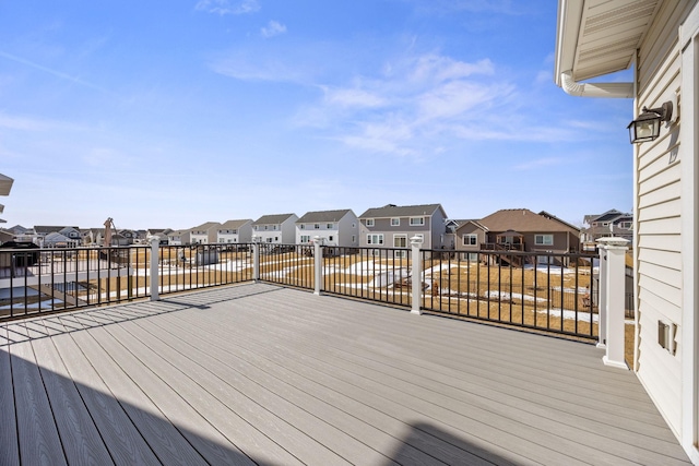 wooden deck with a residential view