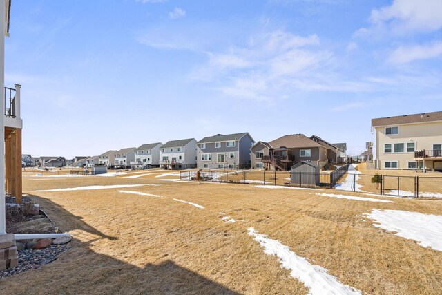 view of yard with fence and a residential view